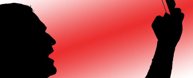 Black silhouette of a man's head and raised fist against a red gradient background.